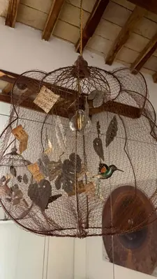 a bird net with birds on it hanging from a ceiling at Monti luxury penthouse in Rome