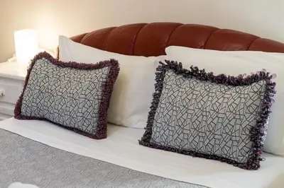 two pillows sitting on top of a bed at Domus Villae Rome Spanish Steps in Rome