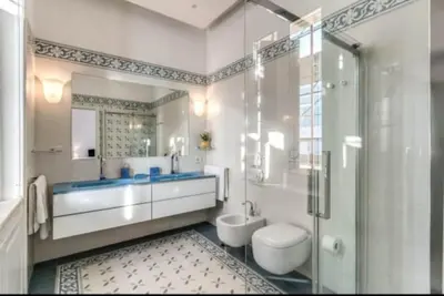 a bathroom with a tub and a toilet and a shower at Barberini Apartment in Rome