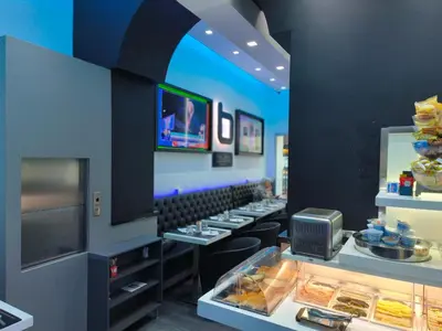 a fast food restaurant with a counter with food at Settecento Guest House in Rome
