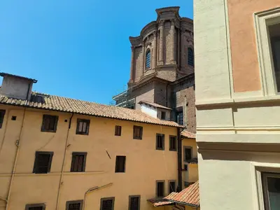 a view of a building with a tower and a church at Settecento Guest House in Rome