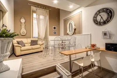 a living room with a couch and a table at Trevi Miracle Suite in Rome