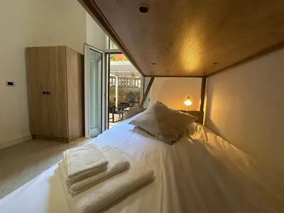 a bedroom with a bed with towels on it at Villa Borghese Home & Terrace in Rome