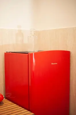 a bathroom sink with a soap dispenser on it at Ludovisi seminterrato loft in Rome