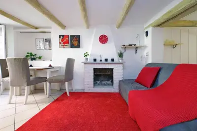 a living room with a couch and a fireplace at Al moro in Rome