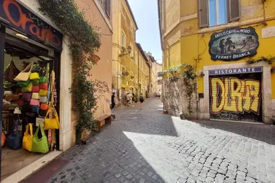 an empty street in a city with buildings at Al moro in Rome
