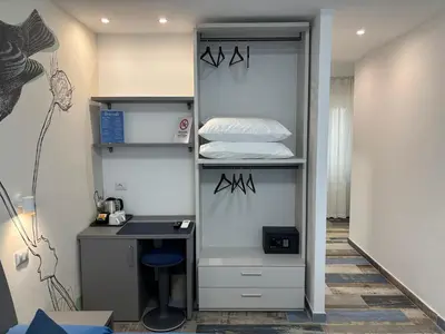 a room with a shelf with a bed and a desk at My Secret Room in Rome