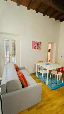 a living room with a couch and a table at Anna Stellarum in Rome