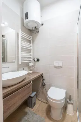 a white bathroom with a sink and a toilet at Sallustiano - Porta Pia - Rooms in Rome