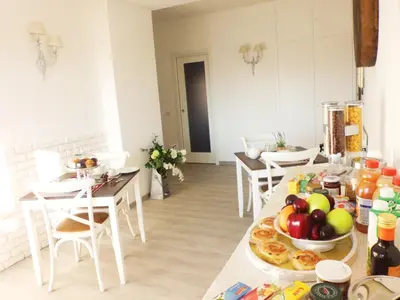 a kitchen with a table with a bunch of food on it at B&B More Than Rome in Rome