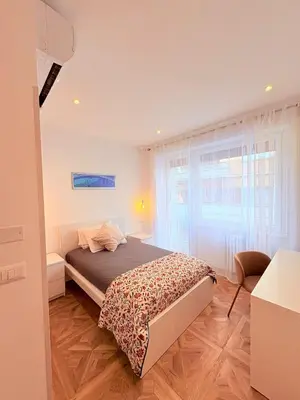 a bedroom with a bed and a window at Vacanze Pamphili in Rome