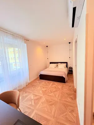 a bedroom with a bed and a large window at Vacanze Pamphili in Rome