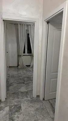 an empty room with white walls and a door at Cataldo Suites Roma in Rome