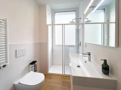 a white bathroom with a toilet and a sink at Pop House Labicana in Rome