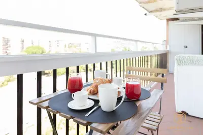 a table with tea and croissants on a balcony at Imperium Trastevere Flat - 4-6 pax, A-C, Panoramic view, 2 Baths in Rome