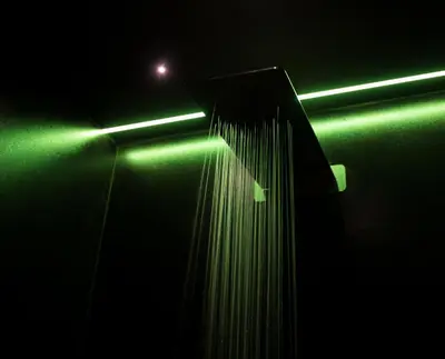 a bathroom with a shower with a green light at Jb Relais Luxury in Rome