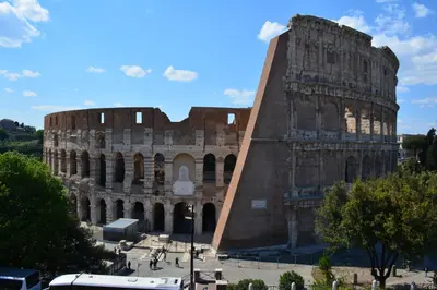 a view of the colosseum in front of a building at Musa Apartments in Rome