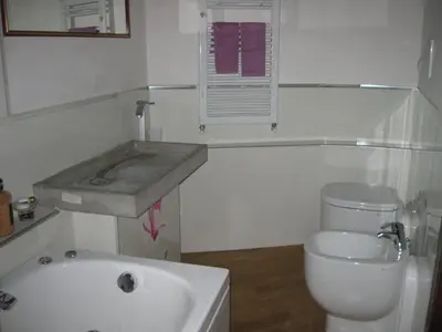a bathroom with a sink and a toilet at Musa Apartments in Rome