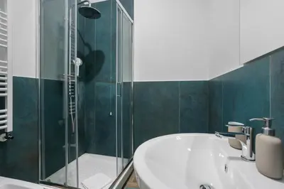 a bathroom with a sink and a glass shower at Conca D'Oro Guest House - Elisabetta in Rome
