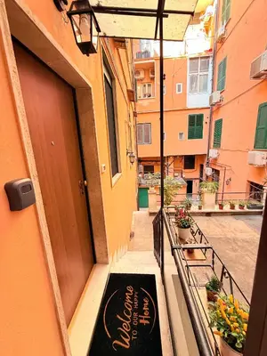 a balcony with a sign on the side of a building at Independent house- Heart of Rome in Rome