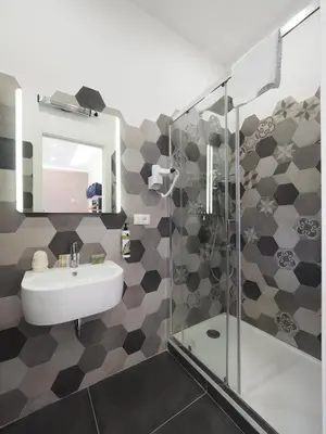 a bathroom with a sink and a shower at Casa Di David in Rome