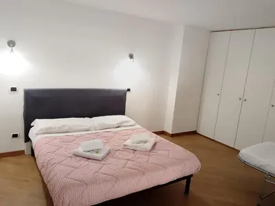 a bedroom with a bed with two towels on it at Charming Apartment in Trastevere in Rome