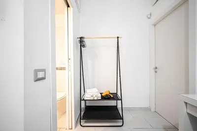 a bathroom with a stand up shower with a mirror at Domus Lodi Urban Stay I Affittacamere in Rome