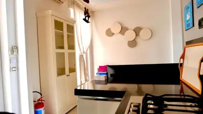 a kitchen with a counter top and a window at Entire Flat at Last floor in Piazza Bologna in Rome