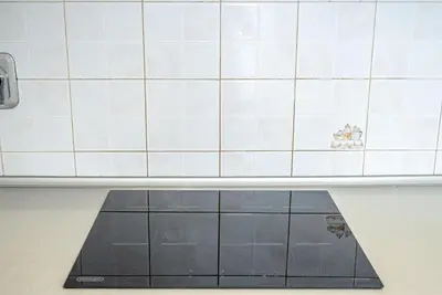 a counter in a kitchen with a tile wall at Feel at Home I Modern Cozy Apartment in Rome