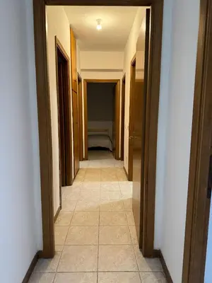 a hallway of a room with a bed in the distance at RAHIMA GUEST HOUSe 2 in Rome