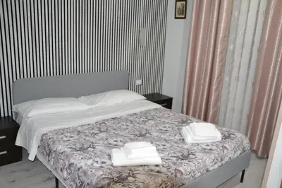 a bedroom with a bed with two towels on it at Aurora Boreale in Rome
