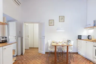 a kitchen with a table and chairs in it at 346aarome Rome Vaccarella Terrace in Rome