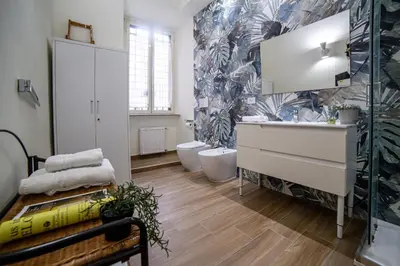a bathroom with a sink and a toilet in a room at New 3BR-2 Baths Near Vatican & Metro- The Comics House in Rome