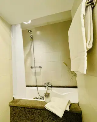 a bathroom with a shower with a sink and a mirror at Very Special Place in the heart of Rome in Rome