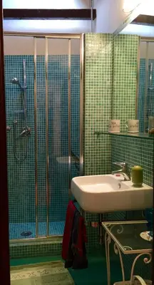 a bathroom with a sink and a glass shower at Very Special Place in the heart of Rome in Rome