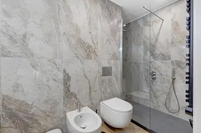 a bathroom with a toilet and a shower and a sink at La Dimora di Piazza Mazzini in Rome