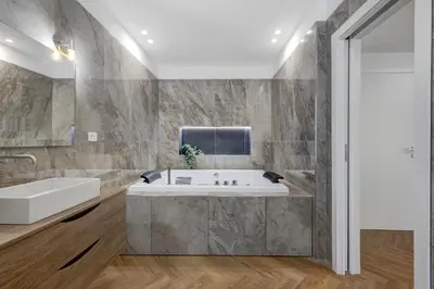 a bathroom with a tub and a sink at Piazza Mazzini Suite con Vasca Idromassaggio in Rome