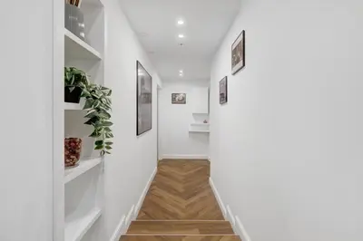 a hallway with white walls and white shelves at Piazza Mazzini Suite con Vasca Idromassaggio in Rome