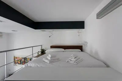 a bedroom with a bed with two towels on it at Casina Albani in Rome