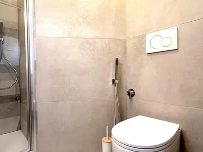 a bathroom with a shower and a toilet in it at Casa della Musica - Guesthouse in Rome