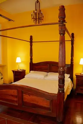 a bedroom with a large wooden bed in a room at Residenza Ducale in Rome
