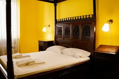 a bedroom with a bed with a wooden head board at Residenza Ducale in Rome