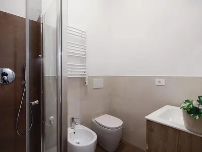 a bathroom with a toilet and a sink and a shower at Enjoy Rome San Paolo Retreat in Rome