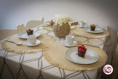 a table with plates of food on top at Domus Latina heart San Giovanni in Rome