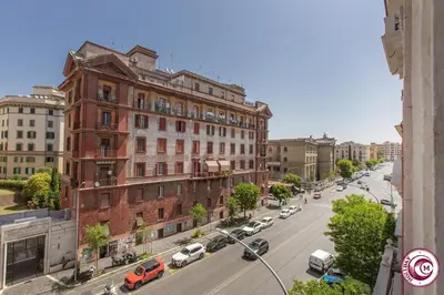 a view of a city street with cars parked on the road at Domus Latina heart San Giovanni in Rome