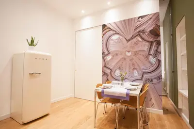 a dining room with a table and a wall mural at Corso 277 Apartment in Rome