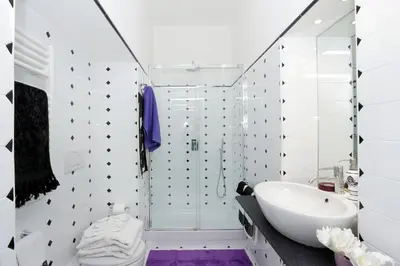 a white bathroom with a sink and a shower at Residenza Romana Zucchelli in Rome