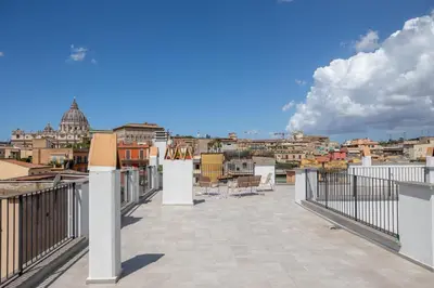 a balcony with a view of a city at iFlat Scenic Penthouse with Terrace near Vatican in Rome