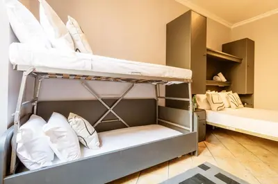 a bunk bed room with two bunk beds at Cunabu Calatafimi in Rome