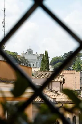 a view of a city through a window at Trastevere Luxury Apartment in Rome